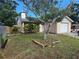 A quaint single-story home with a one car garage is enhanced by a well-kept lawn and a large front yard at 7920 52Nd N St, Pinellas Park, FL 33781