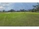 Expansive green space offers recreational opportunities and community gathering areas with paths and mature trees at 7920 52Nd N St, Pinellas Park, FL 33781