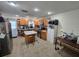 A functional kitchen featuring stainless steel appliances, an island, and ample cabinet space at 7920 52Nd N St, Pinellas Park, FL 33781