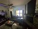 A charming living area featuring a stone fireplace, vaulted ceilings, and abundant natural light at 7920 52Nd N St, Pinellas Park, FL 33781
