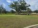 Scenic park featuring mature trees, picnic benches, and open green space for outdoor activities and relaxation at 7920 52Nd N St, Pinellas Park, FL 33781