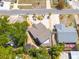 Aerial view of home showcasing driveway, landscaping, backyard with surrounding neighborhood and trees at 941 65Th S St, St Petersburg, FL 33707