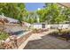 Inviting backyard featuring a decorative water feature, paved patio, and lush landscaping at 941 65Th S St, St Petersburg, FL 33707