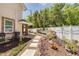 Lush backyard featuring a patio, water feature and leading to a covered patio at 941 65Th S St, St Petersburg, FL 33707