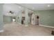 Spacious living room with modern flooring, open floor plan, neutral paint, recessed lights and ceiling fan at 941 65Th S St, St Petersburg, FL 33707