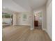 Bright living room with sliding glass doors and an ensuite bathroom featuring a wood vanity at 941 65Th S St, St Petersburg, FL 33707