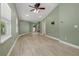 Inviting living area with wood-look floors, neutral walls, and abundant natural light at 941 65Th S St, St Petersburg, FL 33707