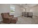 Comfortable loft featuring plush chair and ottoman and stairway to the next level at 941 65Th S St, St Petersburg, FL 33707