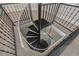 Spiral staircase connecting multiple floors of the home, featuring neutral walls and carpet at 941 65Th S St, St Petersburg, FL 33707