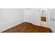 Bedroom with hardwood floors, a double-door closet, and an ensuite bathroom at 10255 Devonshire Lake Dr, Tampa, FL 33647