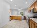 Bright kitchen with stainless appliances, light countertops, and an open floor plan at 10255 Devonshire Lake Dr, Tampa, FL 33647