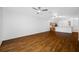 Open-concept living room with wood floors adjacent to the kitchen and dining area at 10255 Devonshire Lake Dr, Tampa, FL 33647