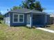 Inviting blue house featuring a cozy front porch and manicured landscaping at 1108 11Th S Ave, St Petersburg, FL 33705