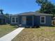 Charming blue home with a well-maintained lawn and inviting front porch at 1108 11Th S Ave, St Petersburg, FL 33705