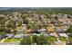 Community aerial view showing the property's location within a neighborhood with mature trees, pools, and privacy at 11110 105Th Ave, Largo, FL 33778