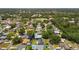 Neighborhood aerial view highlighting the property's setting within lush surroundings, showcasing peaceful suburban living at 11110 105Th Ave, Largo, FL 33778