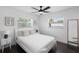 Serene bedroom with dark wood floors, bright natural light, and neutral tones at 11110 105Th Ave, Largo, FL 33778