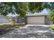 Charming home featuring a well-maintained driveway and an attached two-car garage at 11110 105Th Ave, Largo, FL 33778