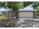 Charming single-story home featuring a two-car garage and a well-maintained front lawn at 11110 105Th Ave, Largo, FL 33778