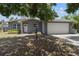 Charming single-story home with a gray brick exterior and a well-maintained two-car garage at 11110 105Th Ave, Largo, FL 33778