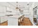 Bright, spacious kitchen with a large island, marble countertops, and stainless steel appliances at 1114 Culbreath Isles Dr, Tampa, FL 33629