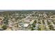 This high-angle view depicts a community with homes, a pool, and shopping in a convenient location at 11447 Park Blvd # 205, Seminole, FL 33772