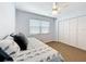 Cozy bedroom with wood-look vinyl flooring, a ceiling fan and a built in daybed with pull out drawers at 11447 Park Blvd # 205, Seminole, FL 33772