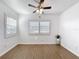 Bright bedroom features wood-look vinyl flooring, shutters and a ceiling fan for added comfort at 11447 Park Blvd # 205, Seminole, FL 33772