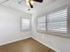 This bedroom offers wood-look vinyl flooring, and light-blocking shutters for restful sleep at 11447 Park Blvd # 205, Seminole, FL 33772