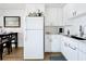 This fully renovated kitchen leads to the living room at 11447 Park Blvd # 205, Seminole, FL 33772
