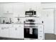A fully renovated kitchen showcases brand-new appliances at 11447 Park Blvd # 205, Seminole, FL 33772