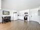 Bright kitchen featuring modern appliances, and cabinetry, as well as a dining area and vinyl wood-look flooring at 11447 Park Blvd # 205, Seminole, FL 33772