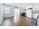 An open-plan living room with gleaming hardwood floors at 11447 Park Blvd # 205, Seminole, FL 33772