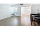 An open-plan living room with gleaming hardwood floors at 11447 Park Blvd # 205, Seminole, FL 33772