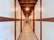 Indoor storage units with repeating doors under wood beams and lighting, centered above tiled floors at 11447 Park Blvd # 205, Seminole, FL 33772