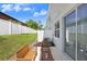 Private outdoor patio featuring seating arrangements and a white fence for enhanced privacy at 11742 Blackbrook Ct, Seffner, FL 33584