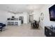 Open-concept living space features a modern kitchen with stainless appliances and an adjacent dining area at 11742 Blackbrook Ct, Seffner, FL 33584