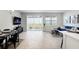 Bright living space with large windows, stylish decor, and a dining area for seamless living at 11742 Blackbrook Ct, Seffner, FL 33584