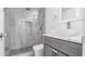 Modern bathroom with a glass-enclosed shower, gray vanity, and a contemporary vessel sink at 12416 Queensland Ln, Tampa, FL 33625