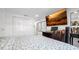 Comfortable bedroom featuring a large TV, desk area, closet, and a patterned comforter at 12416 Queensland Ln, Tampa, FL 33625