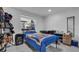 Well-organized bedroom featuring a window, closet, and a playful cartoon-themed bedspread at 12416 Queensland Ln, Tampa, FL 33625