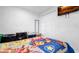 Neat bedroom featuring a TV, closet, and a youthful cartoon-themed bedspread at 12416 Queensland Ln, Tampa, FL 33625