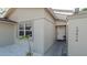 Close-up of the home's entrance, featuring a bright white door and decorative accents at 12416 Queensland Ln, Tampa, FL 33625