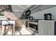 Outdoor kitchen featuring stainless steel appliances and ample counter space, ideal for hosting gatherings at 12416 Queensland Ln, Tampa, FL 33625