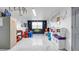 Bright and spacious playroom with colorful decor and ample room for activities at 12416 Queensland Ln, Tampa, FL 33625