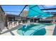 Inviting screened-in pool with modern patio and outdoor kitchen, perfect for entertaining and relaxation at 12416 Queensland Ln, Tampa, FL 33625