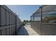 Poolside walkway offers scenic views of the lake and easy access to the screened-in pool area at 12416 Queensland Ln, Tampa, FL 33625