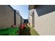 Play area with artificial turf, providing a safe and fun outdoor space for children at 12416 Queensland Ln, Tampa, FL 33625