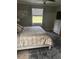Comfortable bedroom with neutral colors and natural lighting at 12619 Richezza Dr, Venice, FL 34293