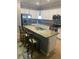 Spacious kitchen featuring granite countertops, stainless appliances, and a functional center island at 12619 Richezza Dr, Venice, FL 34293